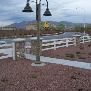 K829 Aurora Sr. fixtures accompanied by Bishop Crook style arms on top of a Canterbury pole.