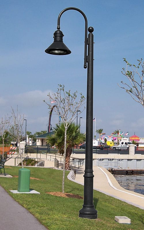 A K828 Moderne Sr. fixture accompanied by a Bishop Crook style arm on top of a Canterbury pole.