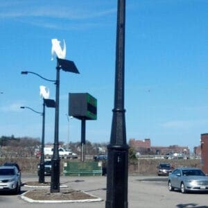 Solar panels and fixtures on top of an Alexander pole.