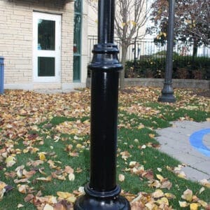 KAS1- Agility Pole - Burlington, Ontario A black aluminum pole with a round non-tapered cross section accompanied by a decorative base plate. This project is in Burlington, Ontario at StressCrete's headquarters.