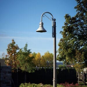 K208 Moderne - Canterbury A K208 Moderne fixture accompanied by a Bishop Crook with decorative scroll arm on a Canterbury pole.