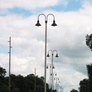 K208 Moderne - Kensington K208 Moderne fixtures accompanied by Wisconsin style arms on a Kensington pole.