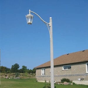 A K56 Tudor fixture accompanied by a Scroll style arm on a Washington pole.