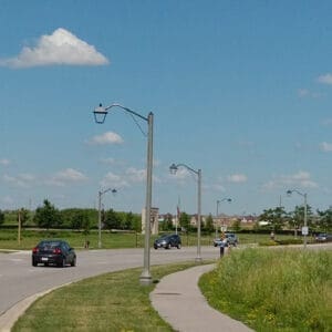 A K601D Coach Lantern accompanied by the Coach Lantern arm on top of a Belmont pole. This project is in Oakville, Ontario.