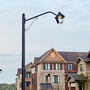 K601D Coach Lantern fixture accompanied by Coach Lantern style arms all on top of an Alexander style pole. This project is in Grimsby, Ontario.