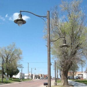 K707 Doral Jr. fixtures accompanied by scroll style arms on top of a Belmont pole.