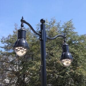 K803 Solitaire Sr. fixtures accompanied by Pipe style arms all on a Fluted Tapered pole. This project is in Philadelphia, Pennsylvania.