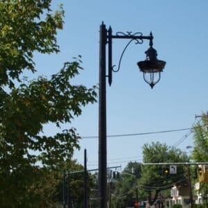 A K841 New City fixture accompanied by a custom-made arm all on a Canterbury pole.