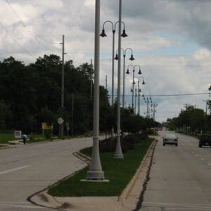 A K208 Moderne fixture accompanied by Wisconsin style arms on a Kensington pole.