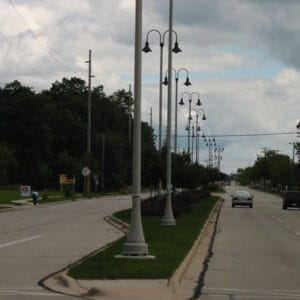 A K208 Moderne fixture accompanied by Wisconsin style arms on a Kensington pole.