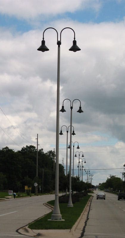 A K208 Moderne fixture accompanied by Wisconsin style arms on a Kensington pole.