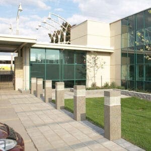 Multiple lit Martello Square style bollards finished with one of our signature concrete décor colors - Ash White.
