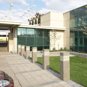 Multiple lit Martello Square style bollards finished with one of our signature concrete décor colors - Ash White.
