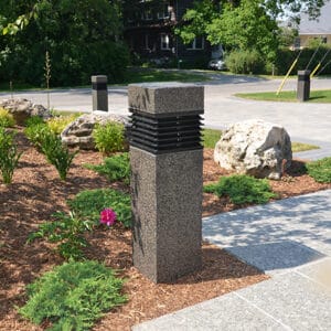 Multiple lit Martello Square style bollards finished with one of our signature concrete décor colors- Pearl Gray.