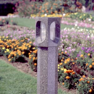 A lit Monitor style bollard finished with one of our signature concrete décor colors – Pearl Gray.