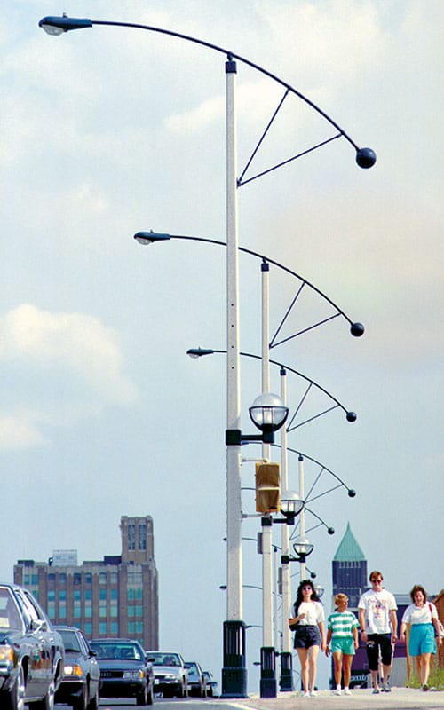 Fixtures and custom-made arms on top of a Square Tapered pole.