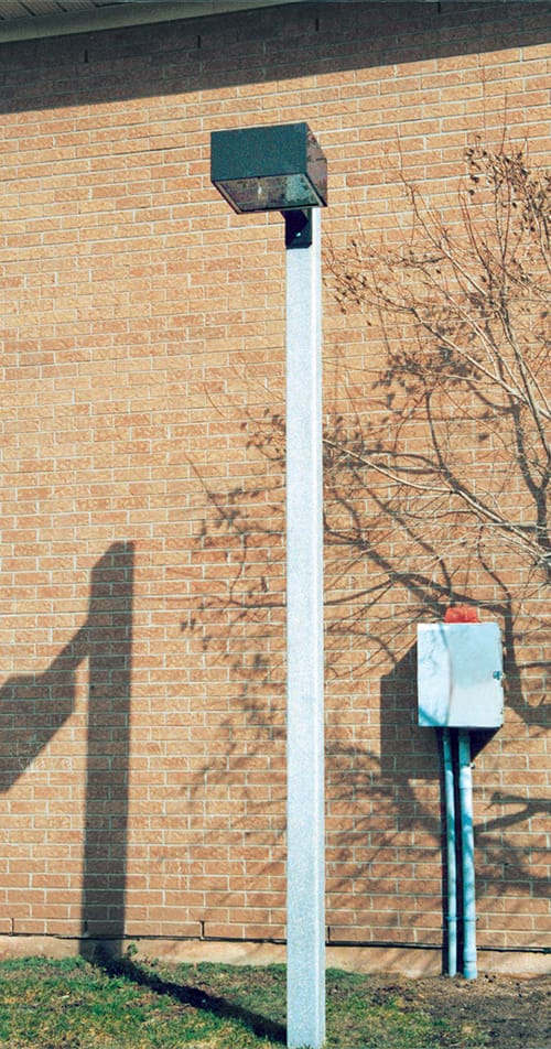 A fixture atop a Square non-tapered pole.