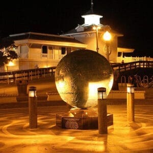 Silhouette Bollard - Concrete - Newport Beach, California Multiple lit Silhouette style bollards finished with one of our signature concrete décor colors - Salt and Pepper. This project is located at Newport Beach Pier in Newport Beach, California.