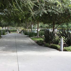 Multiple lit Silhouette bollards finished with one of our signature concrete décor colors - Ash White.