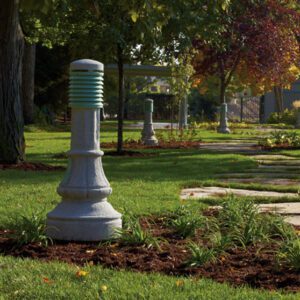Multiple lit Washington bollards finished with one of our signature concrete décor colors - Pearl Gray.