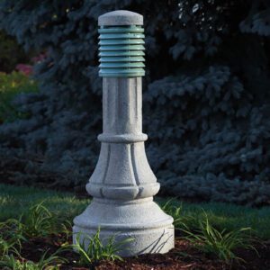 A lit Washington style bollard finished with one of our signature concrete décor colors - Pearl Gray.