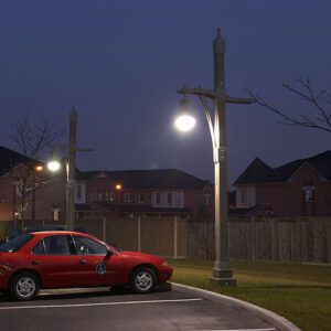 A K803 Solitaire Sr. fixture accompanied by a Pipe style arm on top of a Windsor pole.