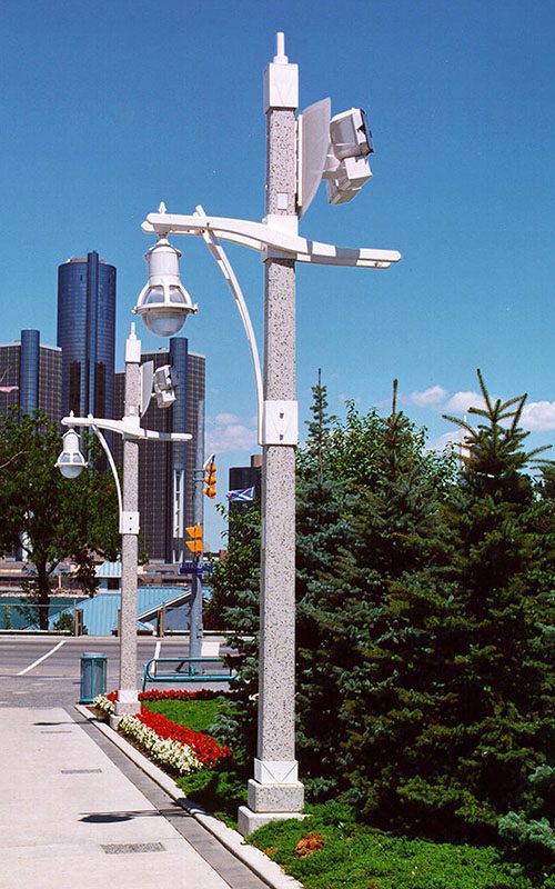 A K833 Solitaire fixture accompanied by a custom style arm on top of a Windsor pole.