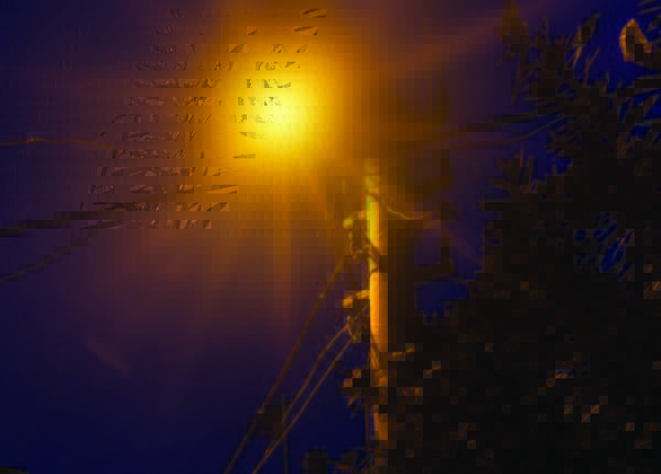 Before the city of Gresham, Oregon partnered with King Luminaire, the city experienced rising power costs to operate their streetlights. Image showcases a glare from a streetlight atop a utility pole.