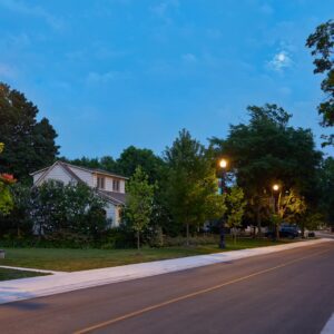 Multiple K423 Allentown fixtures accompanied by banner arms and flowerpot holders all on top of Memphis poles. This project is in a quiet neighborhood in Jordan, Ontario.