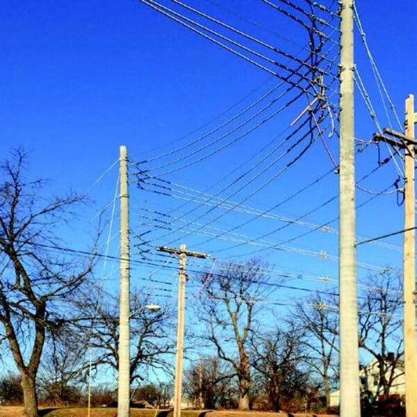 Image shows a few of StressCrete pre-stressed spun concrete poles installed to Kansas City's electrical system. With Kansas City's Board of Public Utilities continuously seeking ways to improve upon their electrical system, the BPU decided to upgrade their system with StressCrete's pre-stressed concrete poles due to their long service life, no maintenance, and lifetime warranty.