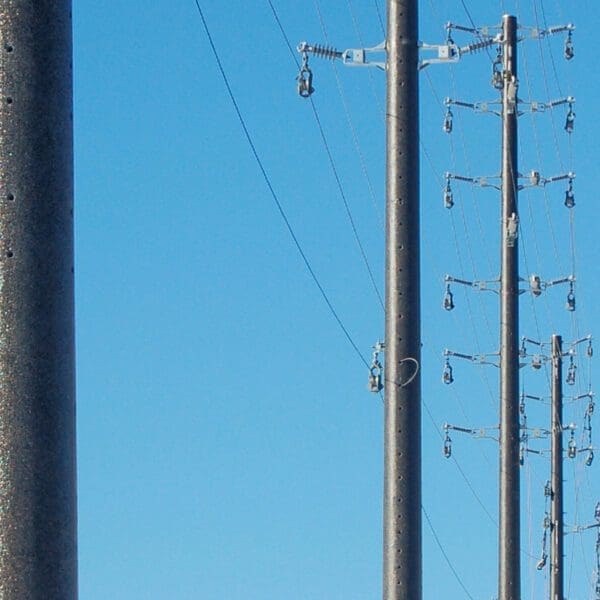 A colored spun concrete utility pole with a 'road crossing' application. This project is off Highway 7 Boulevard in Markham, Ontario.