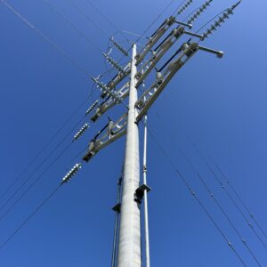A spun concrete utility pole with a 'road crossing' application.