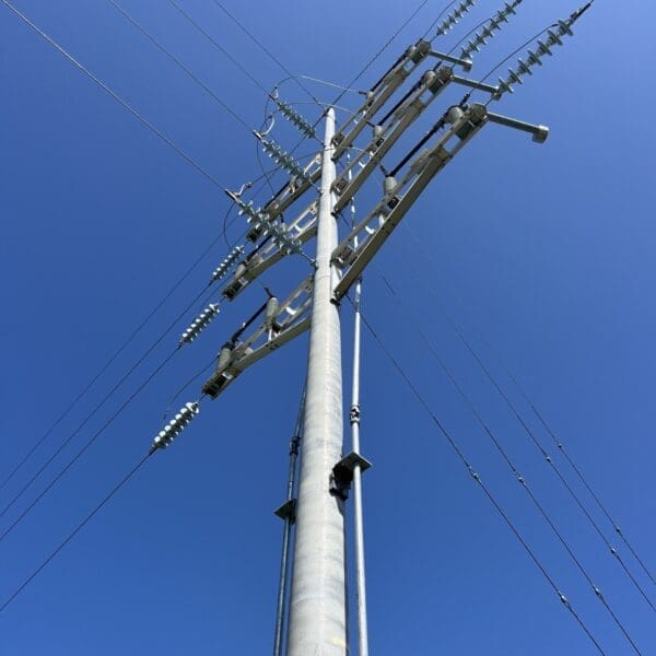 A spun concrete utility pole with a 'road crossing' application.