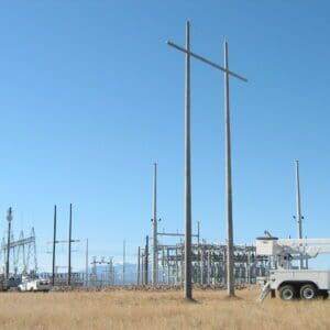 A spun concrete utility pole with an 'H Structure' application. This project is near a high voltage area.