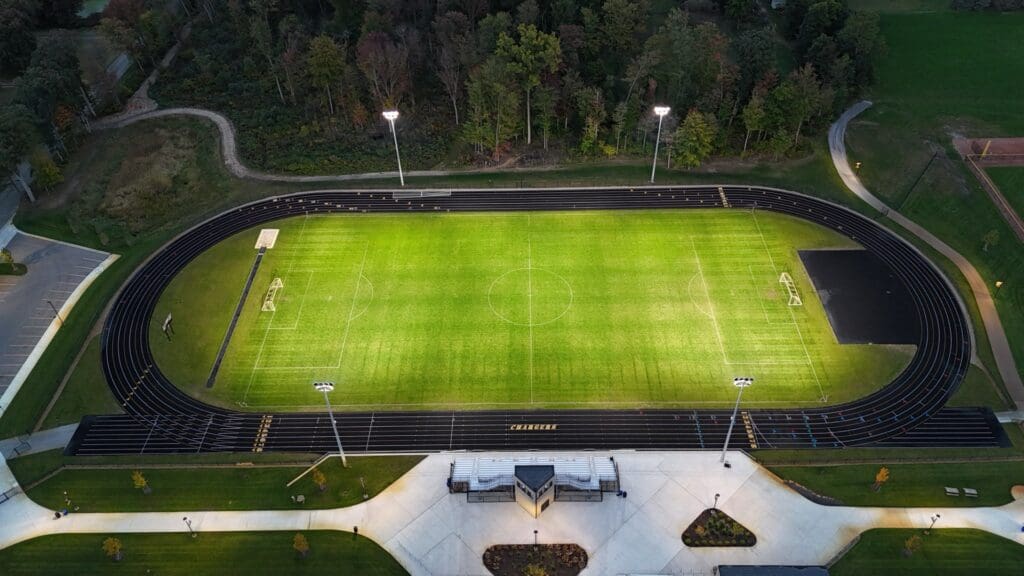 Multiple KSL1 STRATOS fixtures atop of many spun concrete poles. This project is at Covenant Christian High School in Grand Rapids, Michigan.