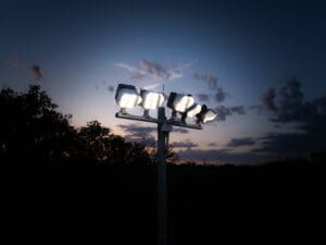 Multiple KSL2 STRATOS mini fixtures atop a spun concrete pole. This project is at the North London Athletic Fields in London.