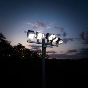 Multiple KSL2 STRATOS mini fixtures atop a spun concrete pole. This project is at the North London Athletic Fields in London.