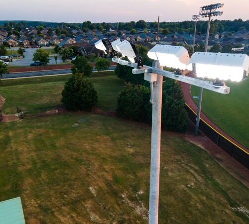 KSL1 STRATOS fixtures accompanied by a cross arm atop of a sports lighting pole. This project is at Shelton State Community College's softball diamonds in Tuscaloosa, Alabama.